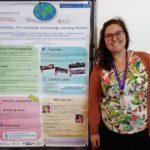 Amy Mónaco presenting a poster about Immunopaedia mission and goals. Highlighting the courses availables, the ambassador program and other immunology content on our website